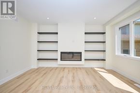Niagara Falls (Ascot) apartment for rent - A white room with a fireplace and shelves.