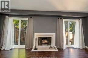 Windsor townhouse for rent - A living room with a fireplace and curtains.