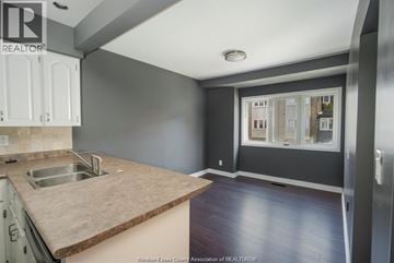 Windsor townhouse for rent - A kitchen with a sink and a window.