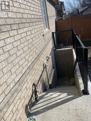 Mississauga (Meadowvale) apartment for rent - A staircase with a metal railing leads up to a door.