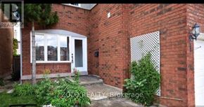 Brampton (Sandringham-Wellington) apartment for rent - A brick house with a white door and windows.