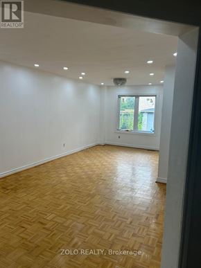 Brampton (Sandringham-Wellington) apartment for rent - A room with wooden flooring and a window.