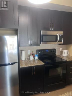 Mississauga (Creditview) condo for rent - A hallway with a coat rack and a sign that says "Cloud Realty Ltd., Brokerage.".