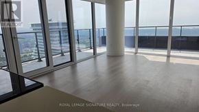 Mississauga (City Centre) condo for rent - A room with a view of the cityscape from a high-rise building.