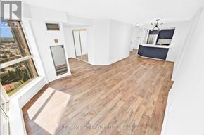Mississauga (City Centre) condo for rent - A large open room with wooden flooring and white walls.