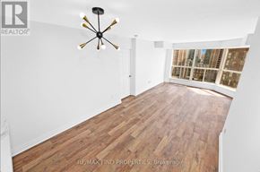 Mississauga (City Centre) condo for rent - A room with wooden flooring and a ceiling fan.