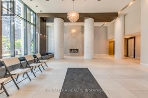 Toronto (Mimico) condo for rent - A reception area with white pillars and chairs.