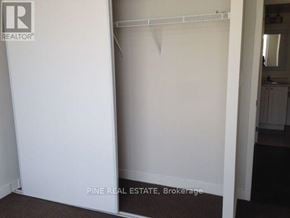 Toronto (Dovercourt-Wallace Emerson-Junction) condo for rent - A white closet with a hanger in it.