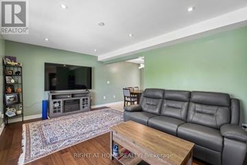 Fort Erie (Lakeshore) apartment for rent - A living room with a grey leather couch and a wooden coffee table.