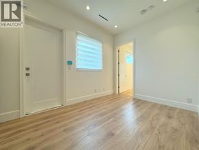 Richmond apartment for rent - A room with wooden flooring and white walls.
