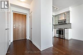 Toronto (Church-Yonge Corridor) condo for rent - A realtor photo of a kitchen with a door in the background.