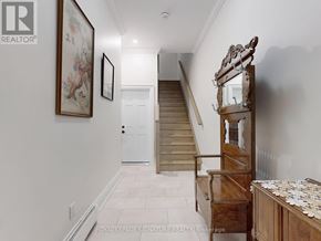 Toronto (Little Portugal) apartment for rent - A hallway with a staircase and a mirror on the wall.