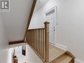 Toronto (Little Portugal) apartment for rent - A white door is on the right side of a staircase.