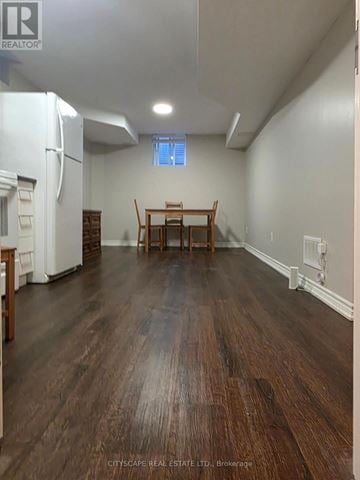 Oakville (Wt West Oak Trails) apartment for rent - A kitchen with a white refrigerator and wooden floors.