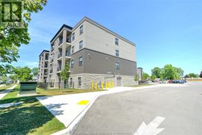 Amherstburg apartment for rent - A building with a parking lot in front of it.
