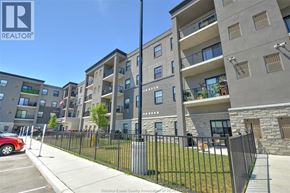 Amherstburg apartment for rent - A building with a sign that says REALTOR on it.