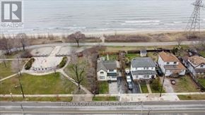 Hamilton (Hamilton Beach) apartment for rent - A bird's eye view of a residential area with houses, a park, and a body of water.