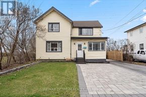 Hamilton (Hamilton Beach) apartment for rent - A two-story house with a front yard and a driveway.