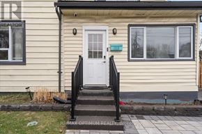 Hamilton (Hamilton Beach) apartment for rent - A beige house with a white door and a small porch.