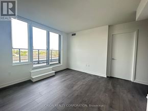 Toronto (Yorkdale-Glen Park) condo for rent - A room with a large window and a door.