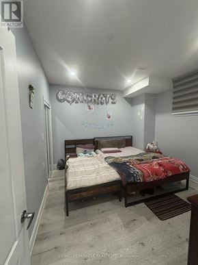 Brampton (Northwest Brampton) apartment for rent - A bedroom with a bed and a sign that says "CONGRATS" on the wall.