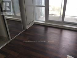 Toronto (South Parkdale) condo for rent - A room with a window and a sign that says "REALTOR".