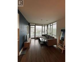 Coquitlam apartment for rent - A living room with a couch and a chair.