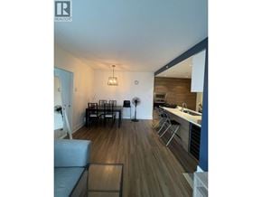 Coquitlam apartment for rent - A modern living room with a grey sofa and a glass coffee table.