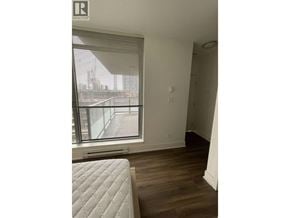 Coquitlam apartment for rent - A bedroom with a large window and a mattress on the floor.
