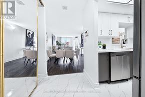 Toronto (Banbury-Don Mills) condo for rent - A modern kitchen with white cabinets and a marble floor.
