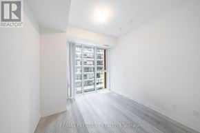 Toronto (Waterfront Communities) condo for rent - A white room with a large window and a sliding glass door.