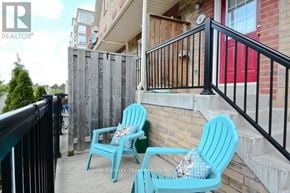 Pickering (Town Centre) townhouse for rent - Two blue chairs are on a balcony.