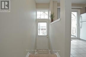 Pickering (Town Centre) townhouse for rent - A white door with a window above it in a room.