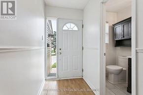 Mississauga (Erin Mills) townhouse for rent - A white door with a window above it in a room.