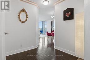 Mississauga (City Centre) condo for rent - A hallway with a mirror and a framed picture on the wall.