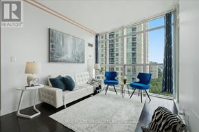 Mississauga (City Centre) condo for rent - A living room with a white couch and blue chairs.