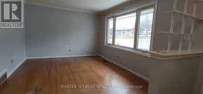 Guelph (St. George's) apartment for rent - A room with wooden floors and a window.