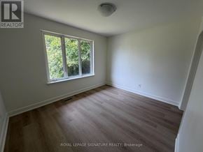 Mississauga (Mississauga Valleys) apartment for rent - A room with a window and wooden flooring.