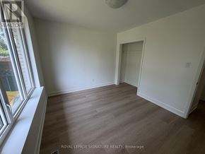 Mississauga (Mississauga Valleys) apartment for rent - A room with wooden flooring and white walls, with a window on the left side.