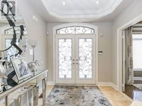 Brampton (Vales Of Castlemore North) apartment for rent - A pair of white doors with decorative glass panels are set in a white wall.