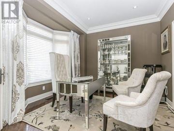 Brampton (Vales Of Castlemore North) apartment for rent - A living room with a glass table and two chairs.