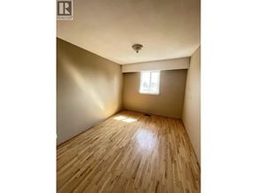 Burnaby apartment for rent - A room with wooden flooring and a window letting in sunlight.