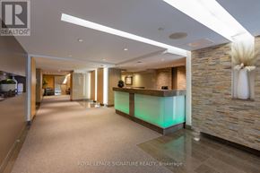 Toronto (Church-Yonge Corridor) condo for rent - A reception area with a green lighted reception desk.