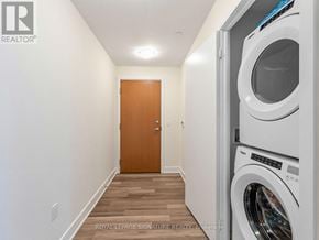 Toronto (Mimico) condo for rent - A laundry room with a washer and dryer in it.