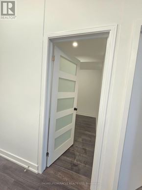Toronto (Clairlea-Birchmount) condo for rent - A white door with a glass panel is open to a hallway.