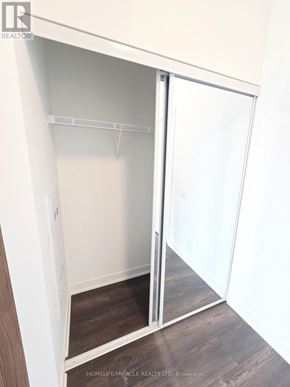 Toronto (Clairlea-Birchmount) condo for rent - A white closet with a sliding door is open.
