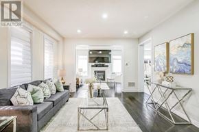 Bradford West Gwillimbury (Bradford) apartment for rent - A modern living room with a grey sofa and a glass coffee table.