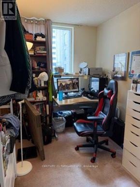 Toronto (Annex) condo for rent - A room with a desk, chair, and computer setup.
