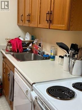 Toronto (Annex) condo for rent - A kitchen with a stove top oven and a dishwasher.
