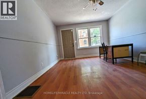 Halton Hills (Georgetown) apartment for rent - A room with wood flooring and a ceiling fan.